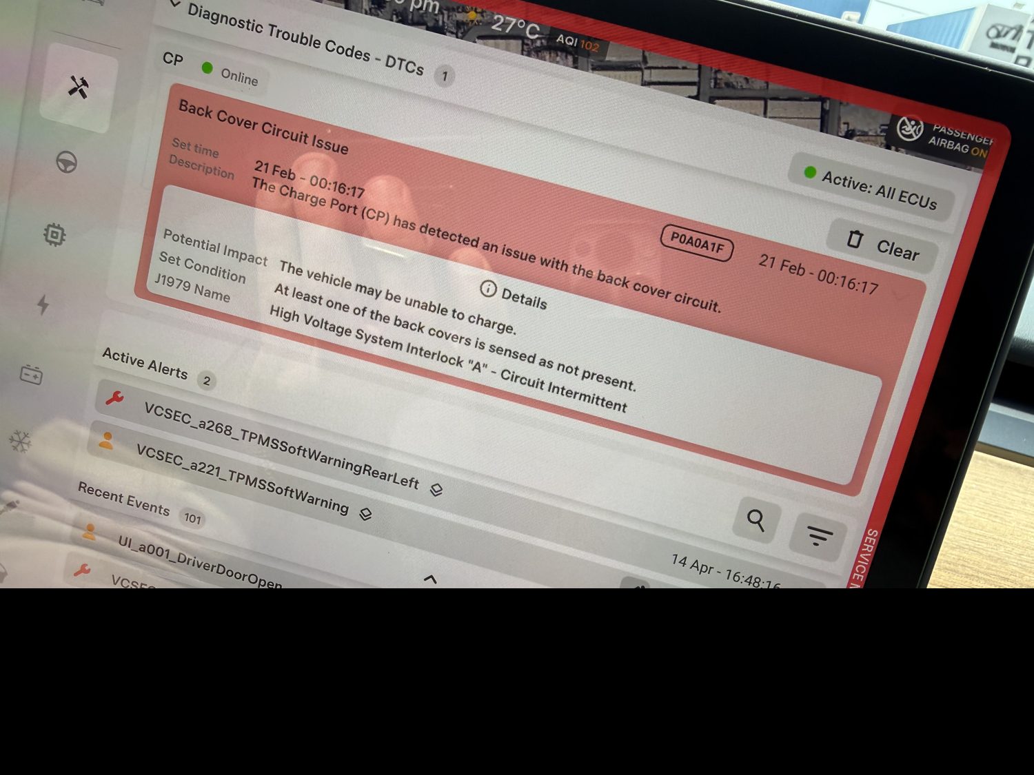 An expanded Tesla Service Mode alert showing a charge-port fault with its description, impact, and set and clear conditions