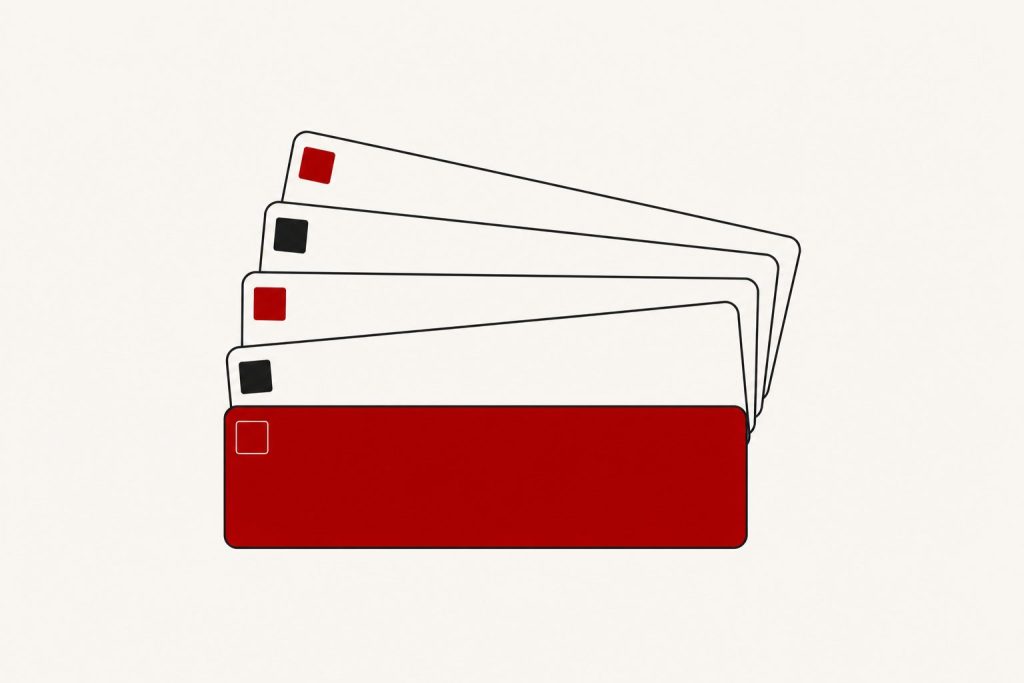 Five blank license-plate shapes fanned on an off-white ground, the front plate solid dark red, small alternating tab squares